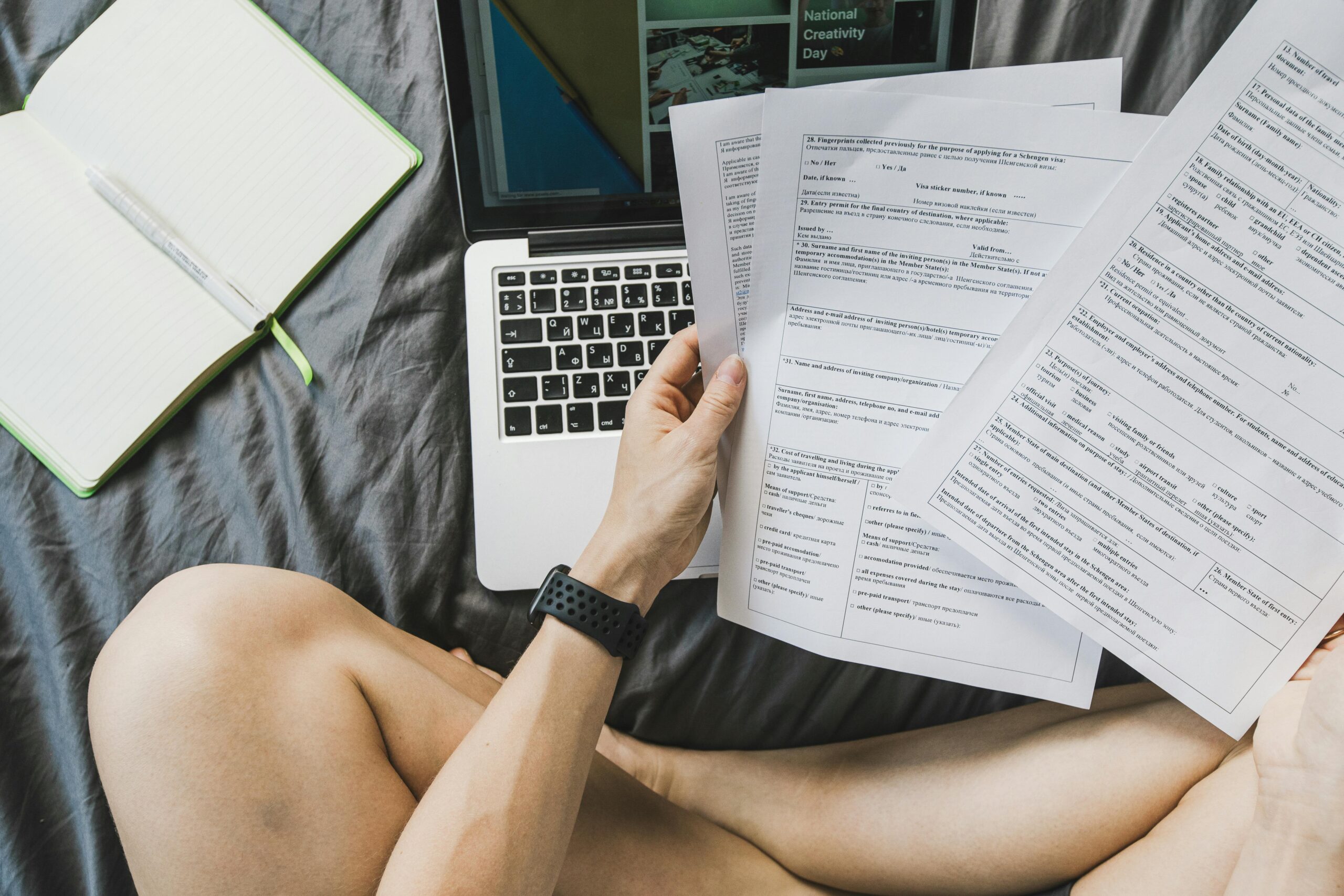 FlyFin vs Keeper Tax comparison — freelancer at desk reviewing 1099 income and tax paperwork